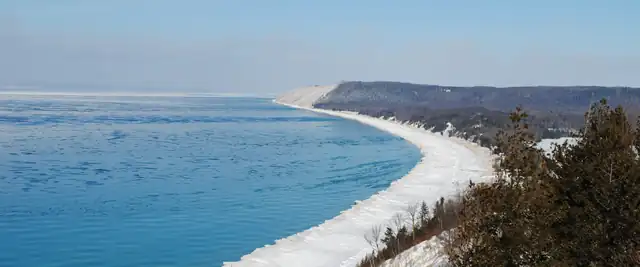 Lake Michigan shoreline below the bluffs at Sleeping Bear Dunes in winter, Michigan